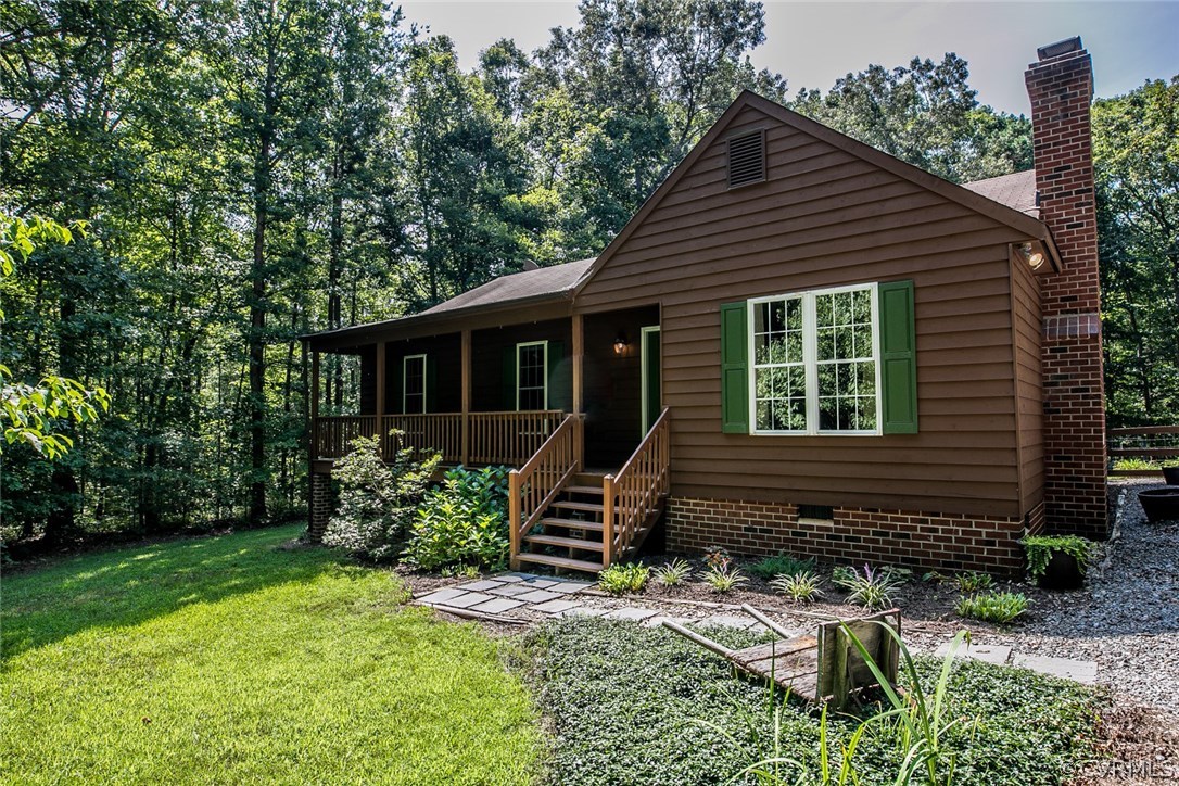564 Jackson Road Bumpass, VA 23024 - Photo 1 of 36 a front view of a house with garden