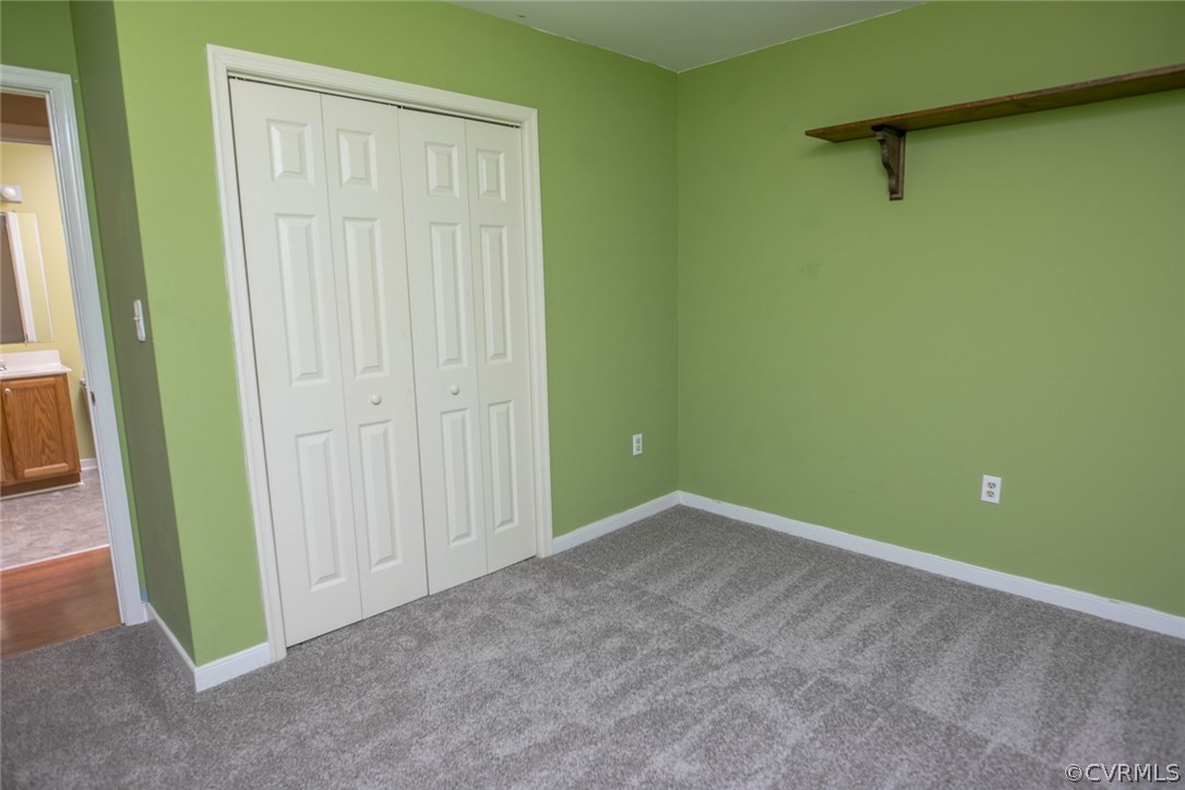 564 Jackson Road Bumpass, VA 23024 - Photo 20 of 36 an empty room with a door