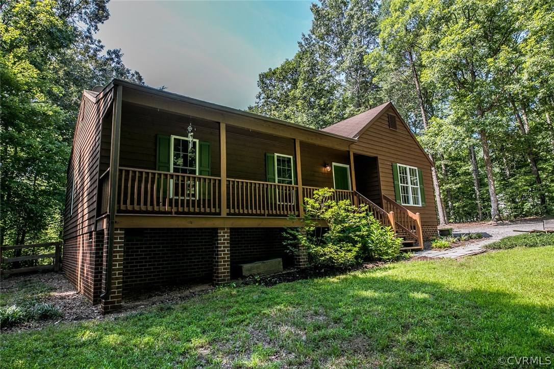 564 Jackson Road Bumpass, VA 23024 - Photo 26 of 36 a front view of a house with garden