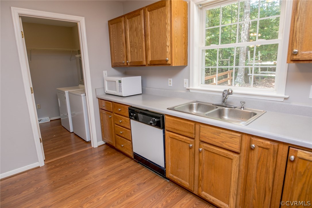 564 Jackson Road Bumpass, VA 23024 - Photo 9 of 36 a kitchen with stainless steel appliances granite countertop wooden cabinets a sink and a window