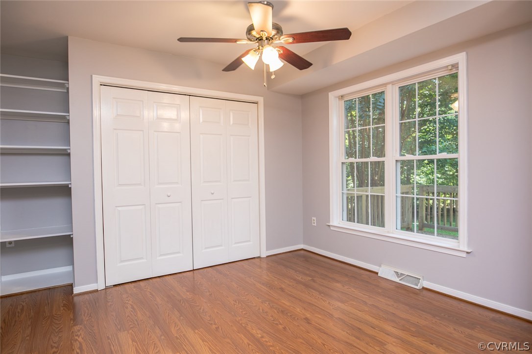 564 Jackson Road Bumpass, VA 23024 - Photo 10 of 36 a view of an empty room with a window and wooden floor