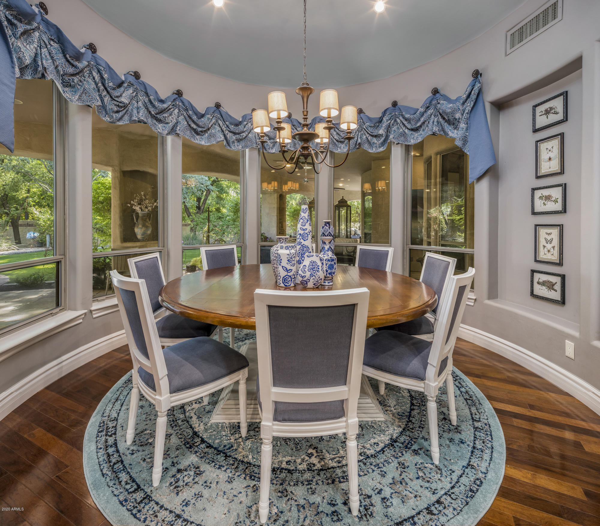 307 West Lamar Road Phoenix, AZ 85013 - Photo 12 of 61 a view of a dining room with furniture wooden floor and chandelier