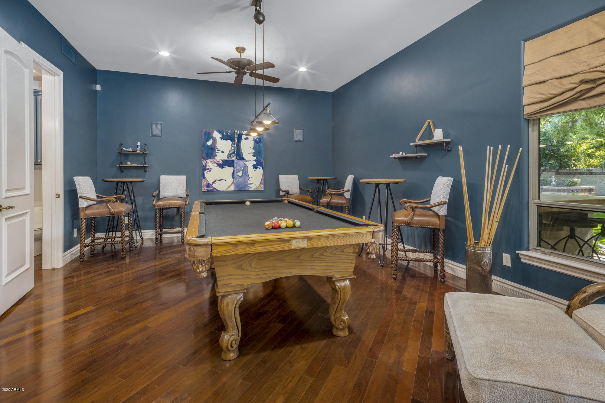 307 West Lamar Road Phoenix, AZ 85013 - Photo 17 of 61 a view of a dining room with furniture a chandelier and wooden floor