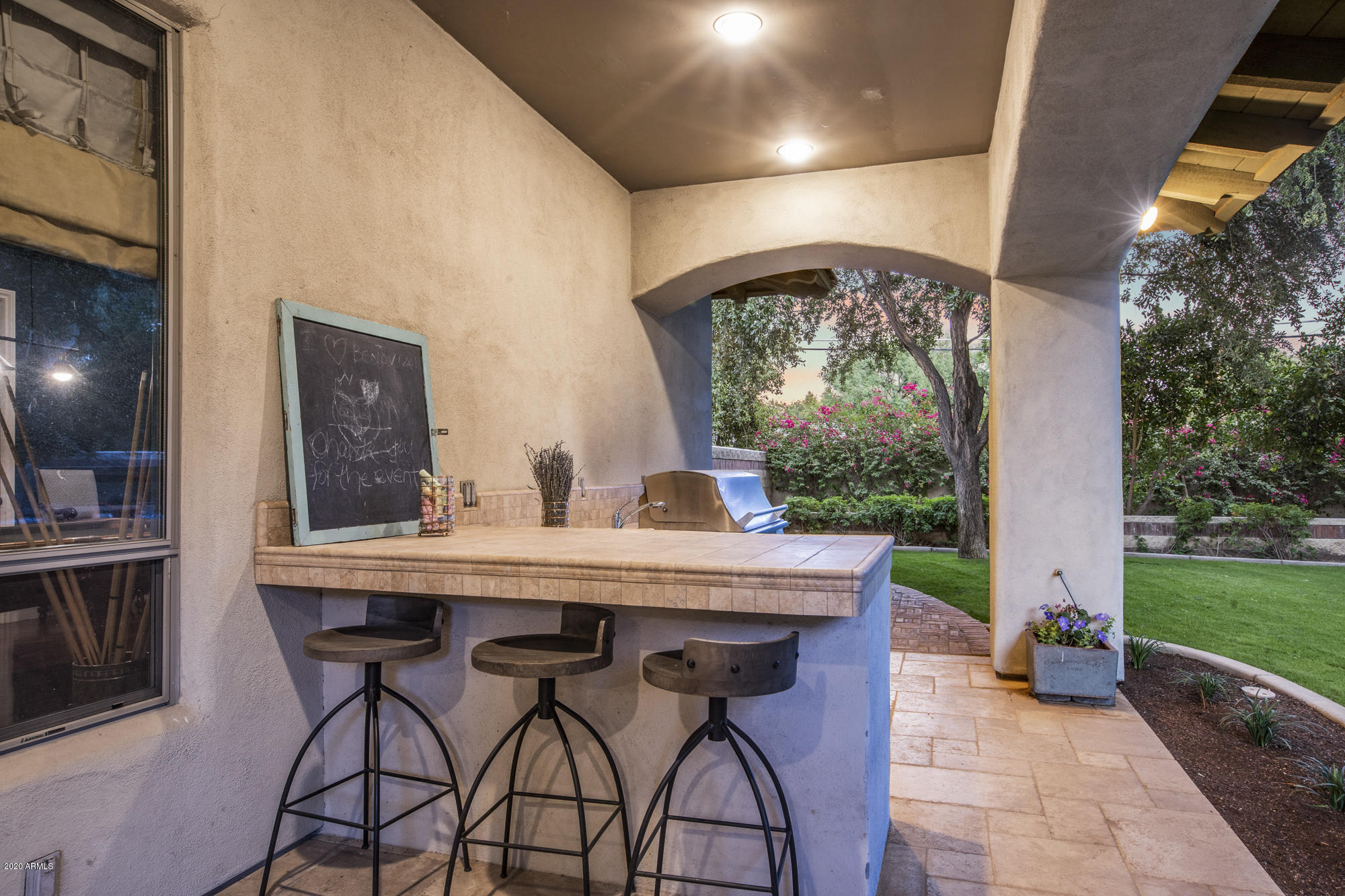 307 West Lamar Road Phoenix, AZ 85013 - Photo 50 of 61 a view of an outdoor dining space with a table and chairs