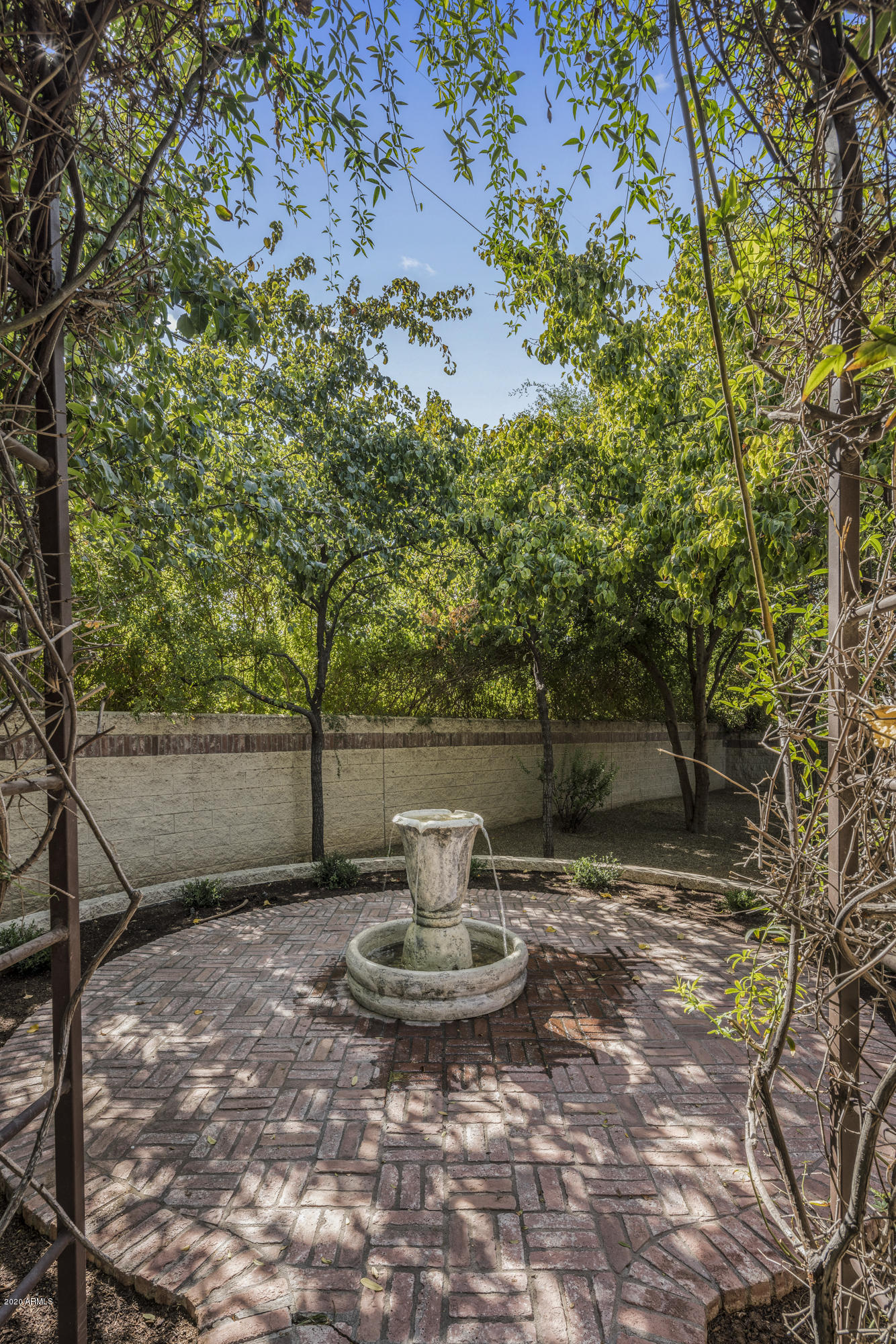 307 West Lamar Road Phoenix, AZ 85013 - Photo 52 of 61 a view of a water fountain in the middle of a yard