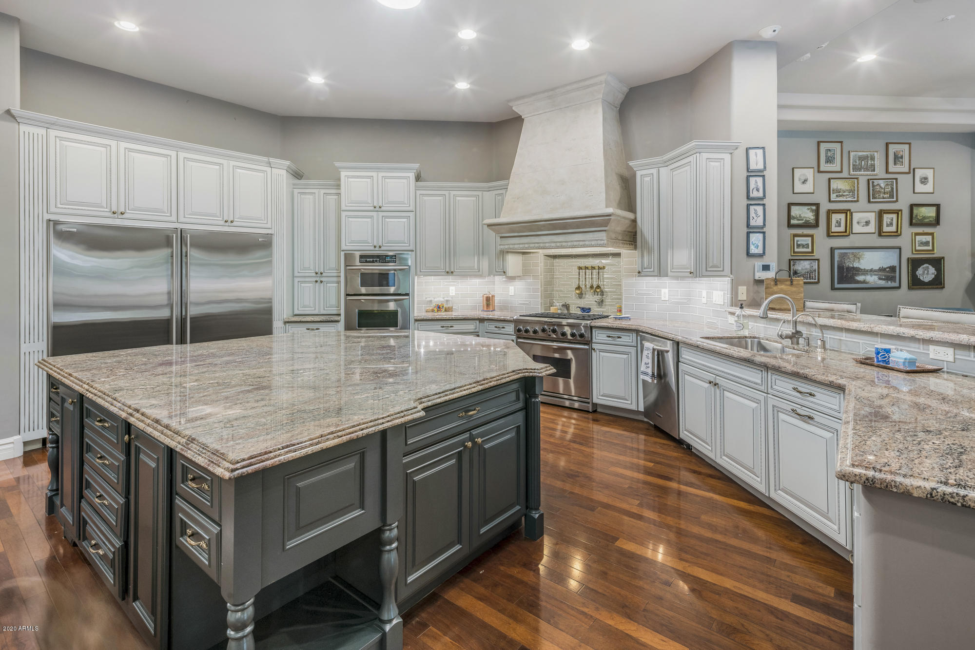 307 West Lamar Road Phoenix, AZ 85013 - Photo 8 of 61 a kitchen with stainless steel appliances granite countertop stove top oven and cabinets