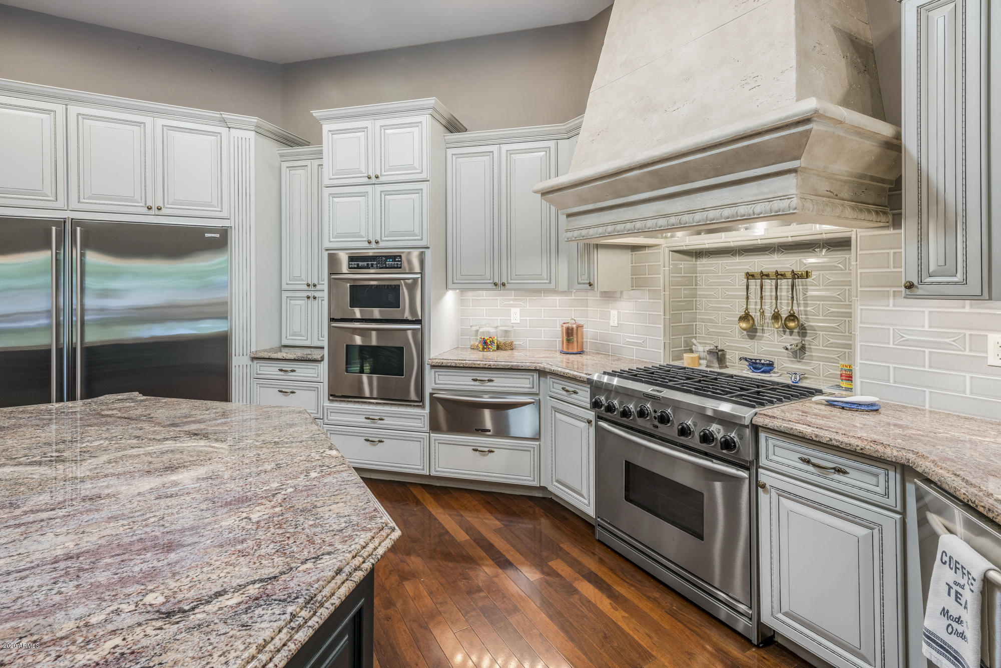 307 West Lamar Road Phoenix, AZ 85013 - Photo 9 of 61 a kitchen with granite countertop a stove and a refrigerator