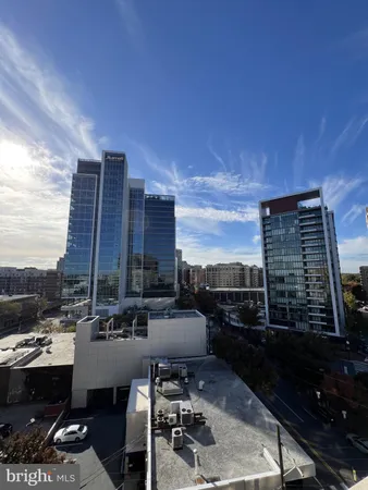 a view of roof deck with seating area and barbeque oven