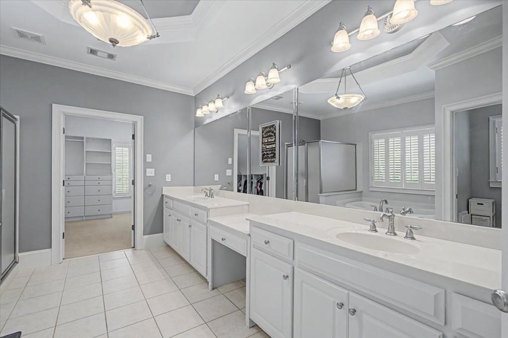122 Ridge View Drive Ball Ground, GA 30107 - Photo 38 of 84 a spacious bathroom with a double vanity sink mirror and a shower