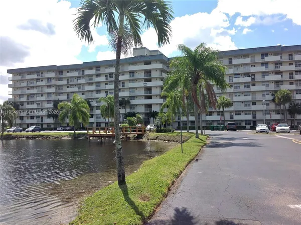 a front view of a building with lake view