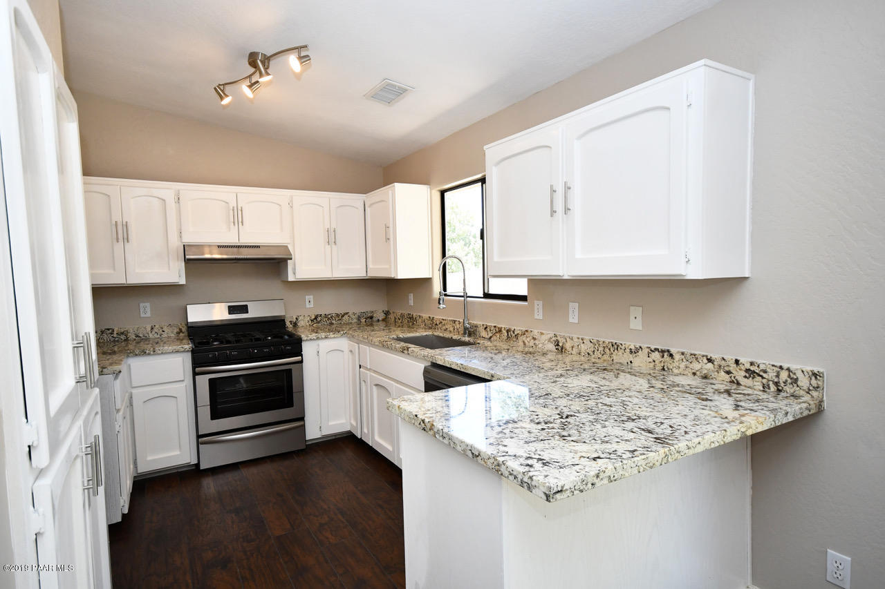 5229 North Long Rifle Road Prescott Valley, AZ 86314 - Photo 4 of 17 Granite and Stainless Kitchen