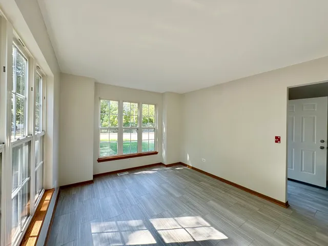 a bathroom with a sink a toilet a mirror a bathtub and shower