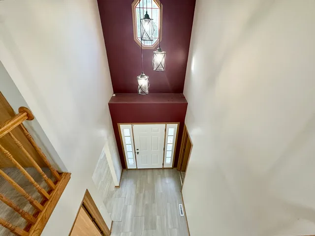 a view of entryway with wooden floor