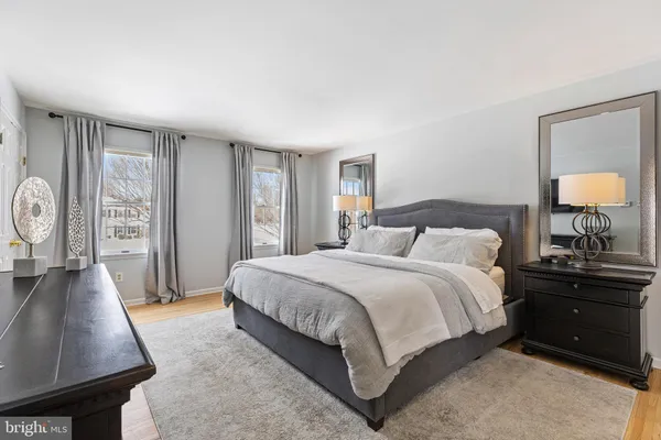 a bedroom with a bed and a night stand