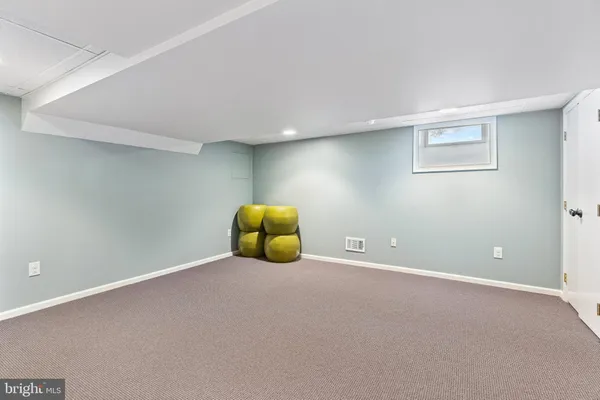 a view of an empty room with a projector