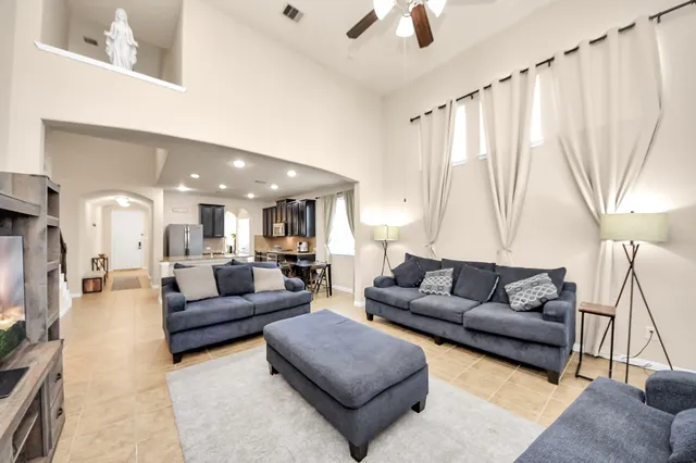 a living room with furniture and a large window