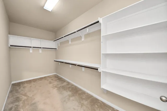 a view of an empty walk in closet