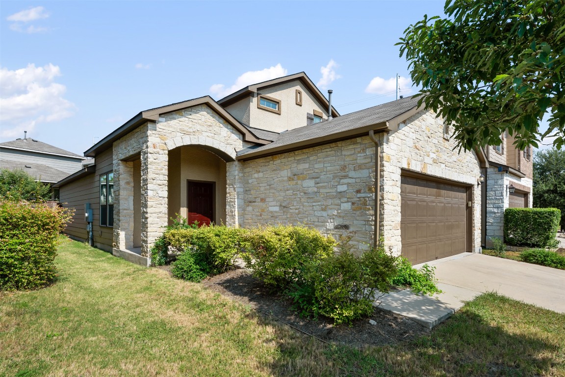 9302 Tanager Way Austin, TX 78748 - Photo 1 of 1 a front view of a house with garden