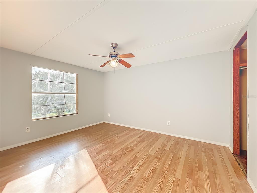 790 South Ebenezer Point Homosassa, FL 34448 - Photo 24 of 46 a view of empty room with wooden floor and fan