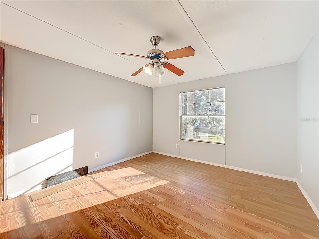 790 South Ebenezer Point Homosassa, FL 34448 - Photo 25 of 46 a view of a room with a chandelier fan and windows