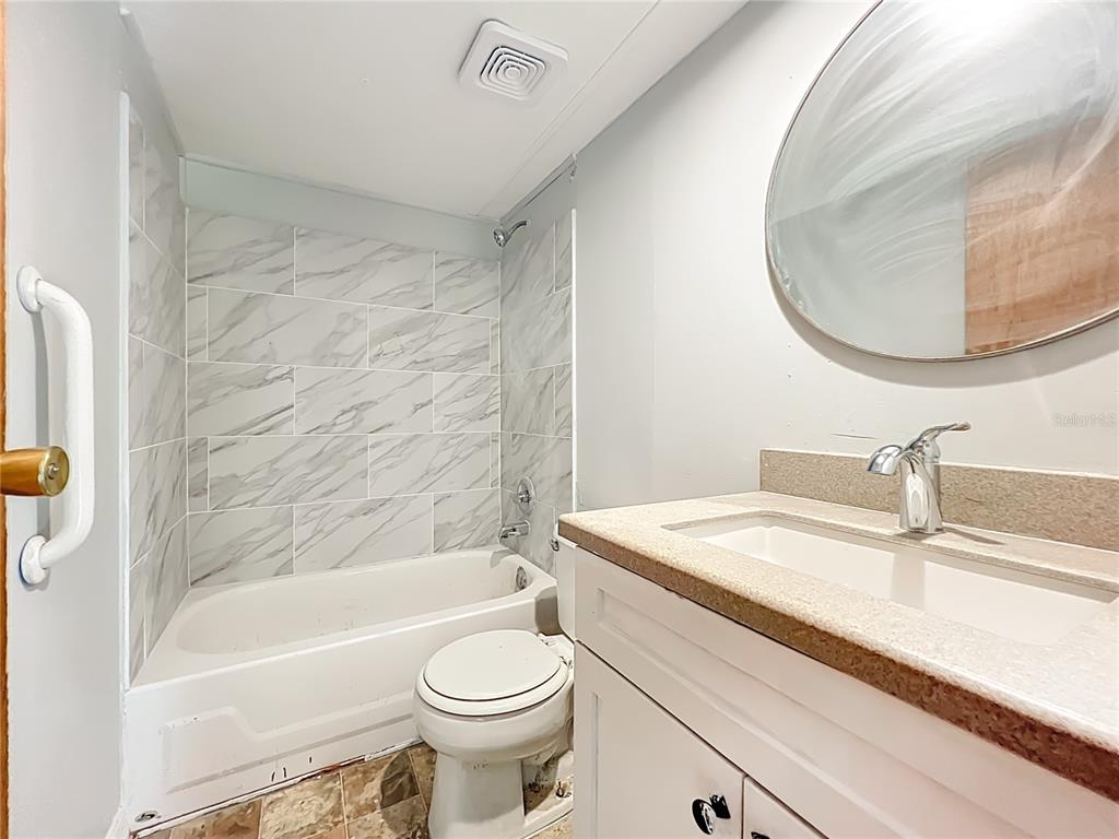 790 South Ebenezer Point Homosassa, FL 34448 - Photo 26 of 46 a bathroom with a sink a toilet and a mirror