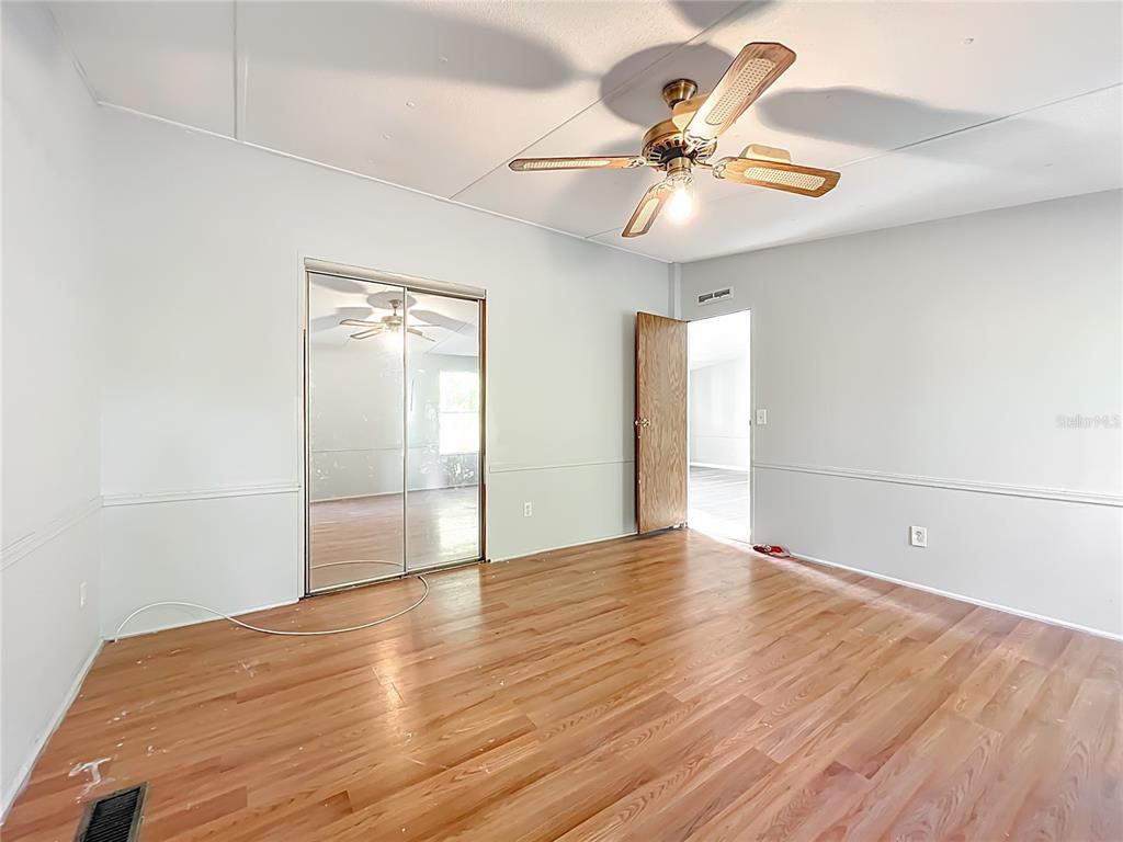 790 South Ebenezer Point Homosassa, FL 34448 - Photo 29 of 46 a view of an empty room with window and wooden floor