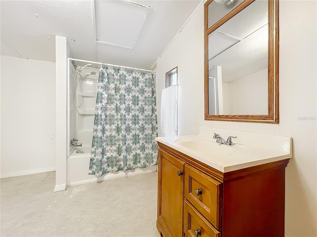 790 South Ebenezer Point Homosassa, FL 34448 - Photo 31 of 46 a utility room with a sink cabinet and a mirror