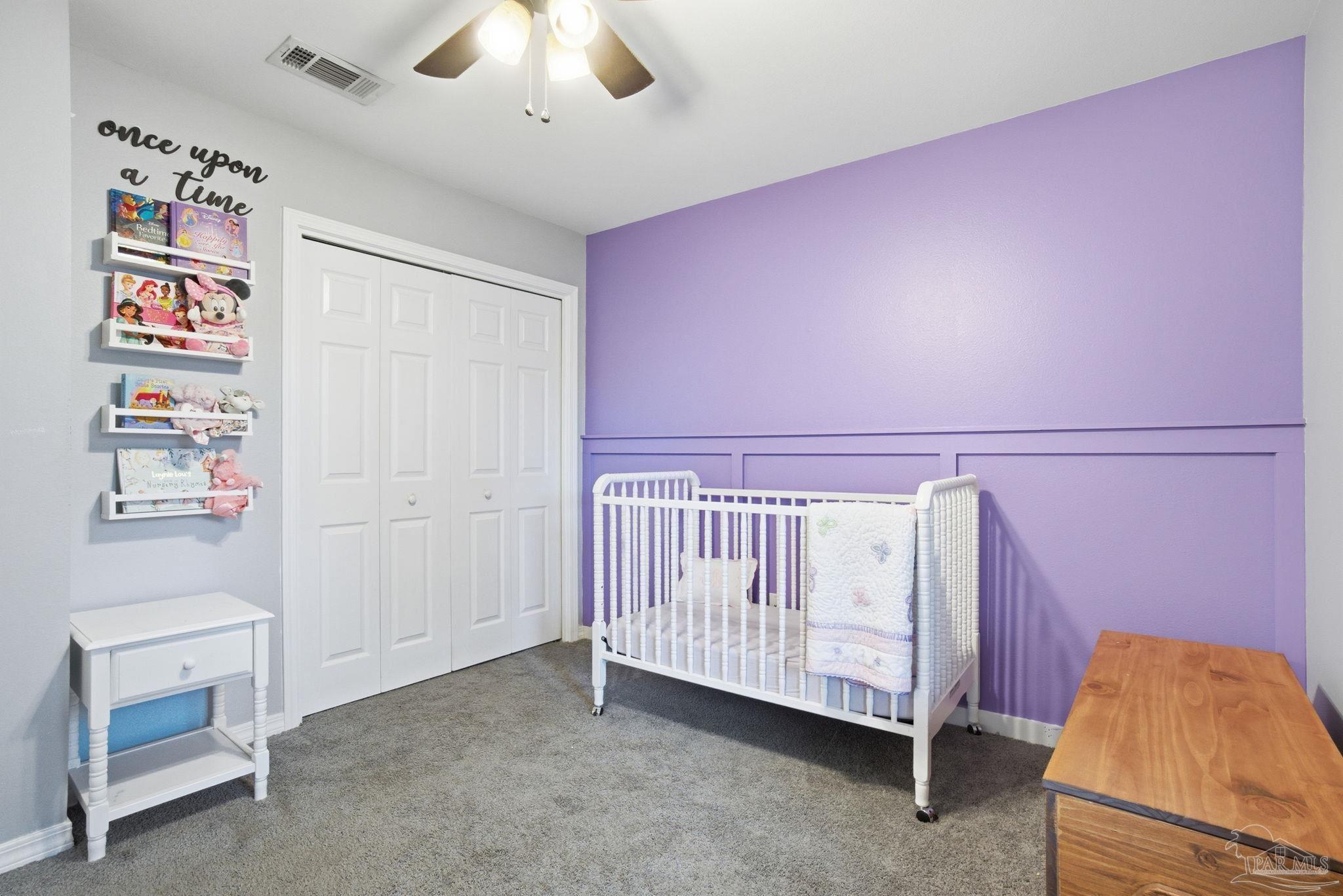 4393 Rice Road Milton, FL 32583 - Photo 20 of 52 a bed room with a bed and a baby