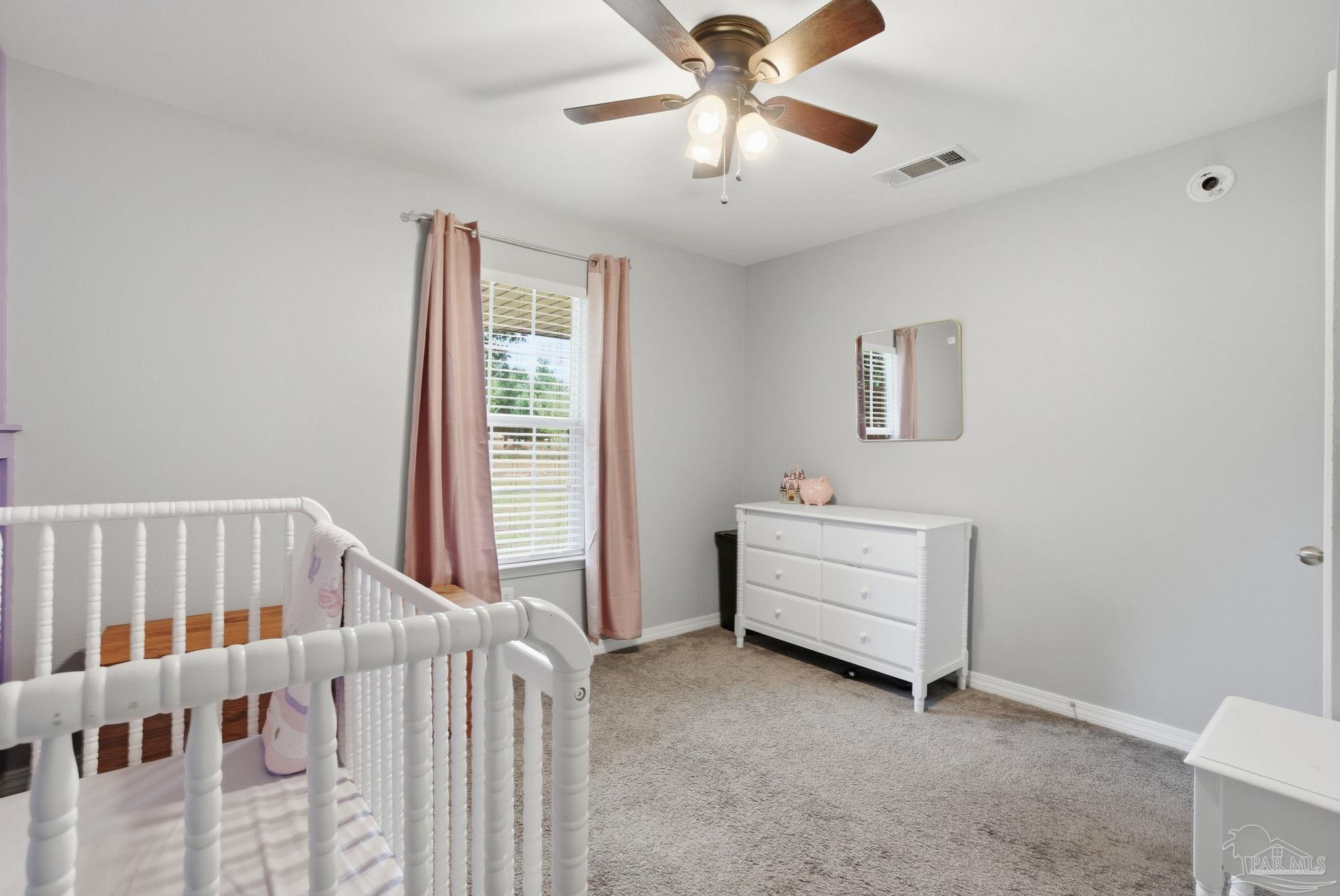 4393 Rice Road Milton, FL 32583 - Photo 21 of 52 a room with a bed and a window