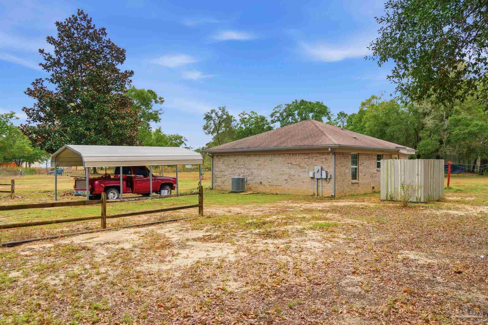 4393 Rice Road Milton, FL 32583 - Photo 24 of 52 a view of an house with backyard and kitchen