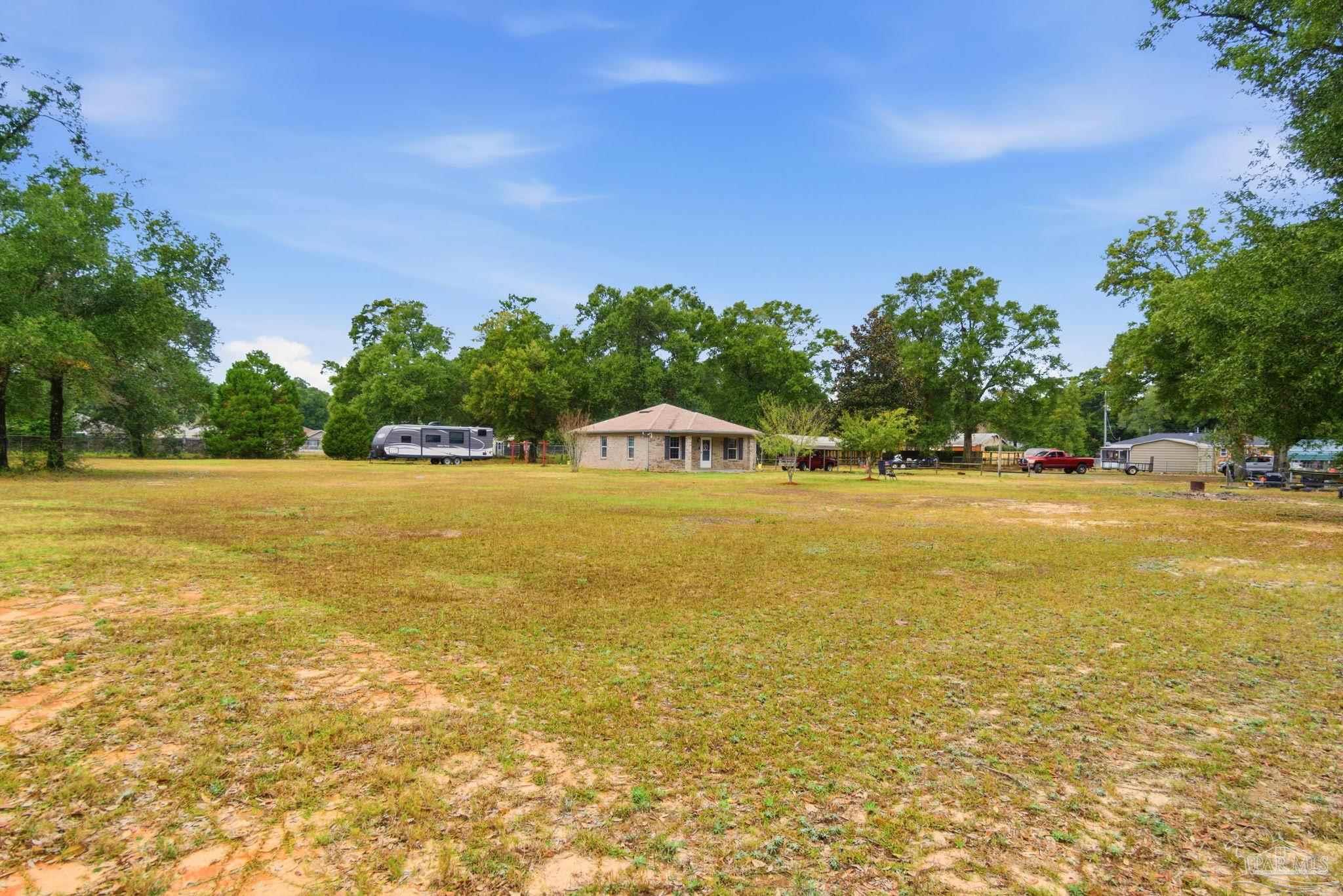 4393 Rice Road Milton, FL 32583 - Photo 27 of 52 a view of an ocean and beach