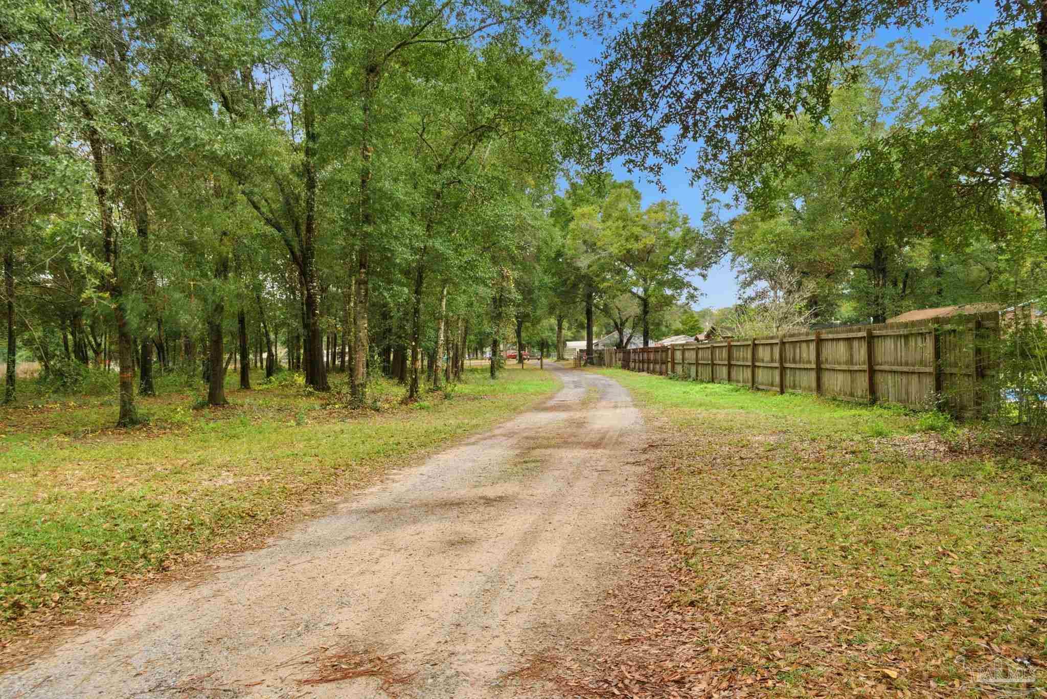 4393 Rice Road Milton, FL 32583 - Photo 31 of 52 a view of backyard with green space