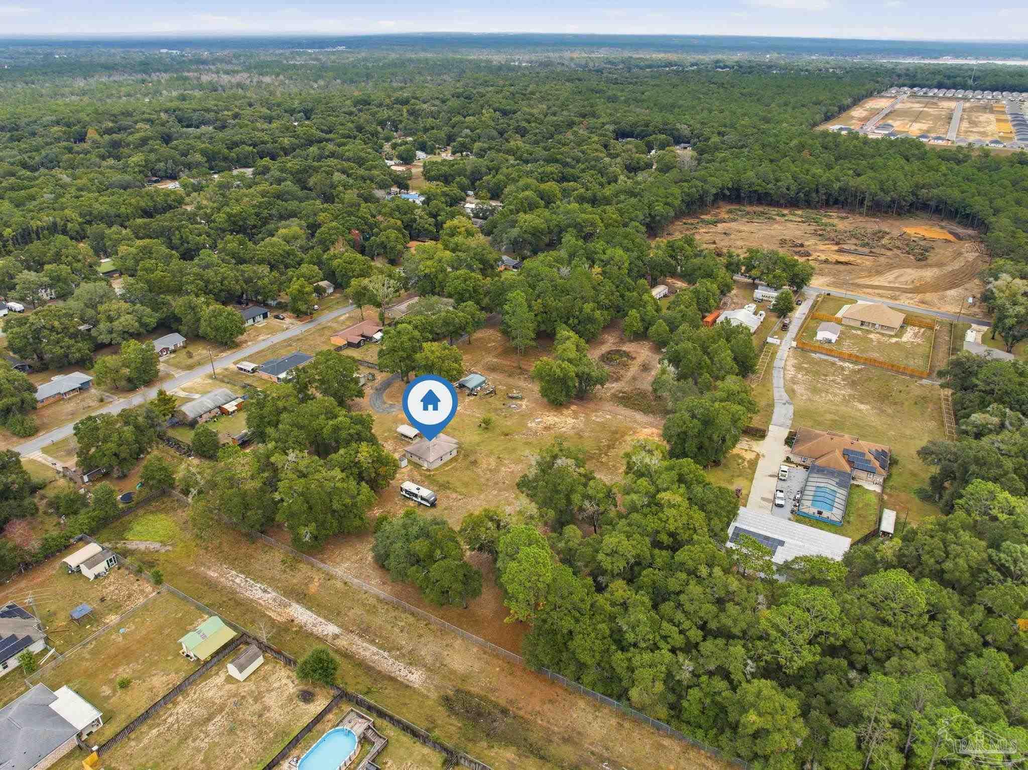 4393 Rice Road Milton, FL 32583 - Photo 34 of 52 an aerial view of a house with a yard