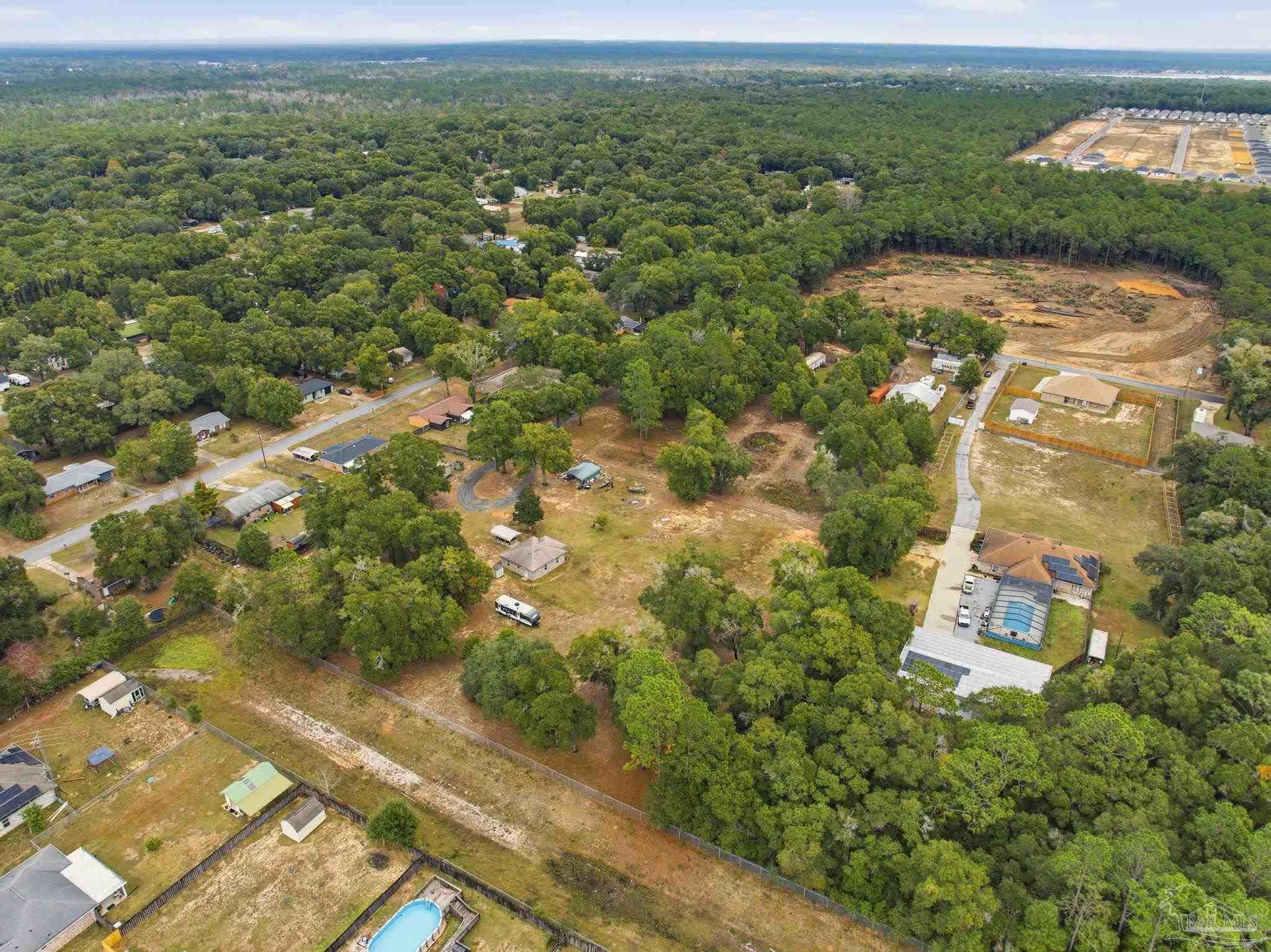 4393 Rice Road Milton, FL 32583 - Photo 35 of 52 an aerial view of a houses with a yard