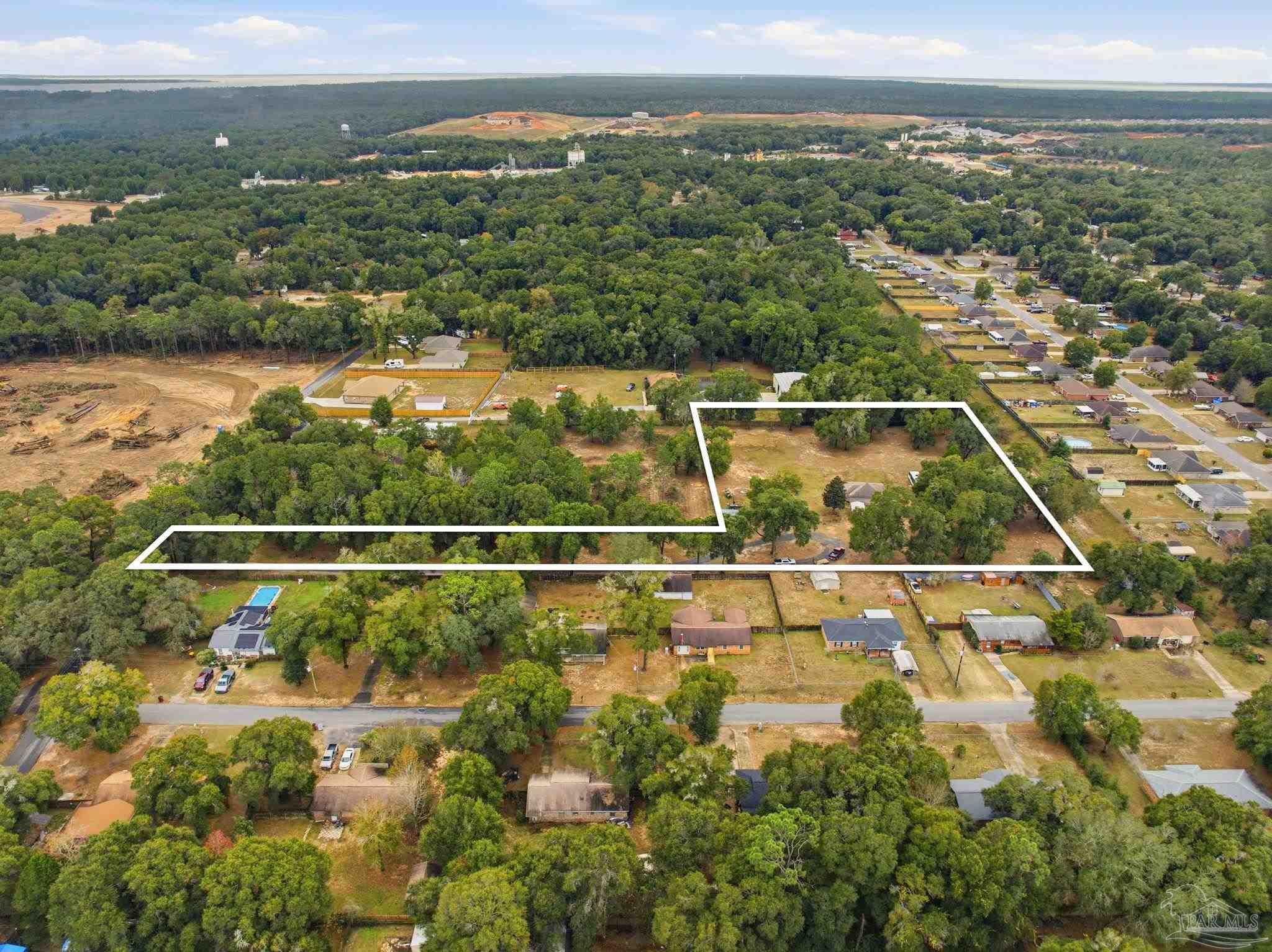 4393 Rice Road Milton, FL 32583 - Photo 41 of 52 an aerial view of residential houses with outdoor space and ocean view