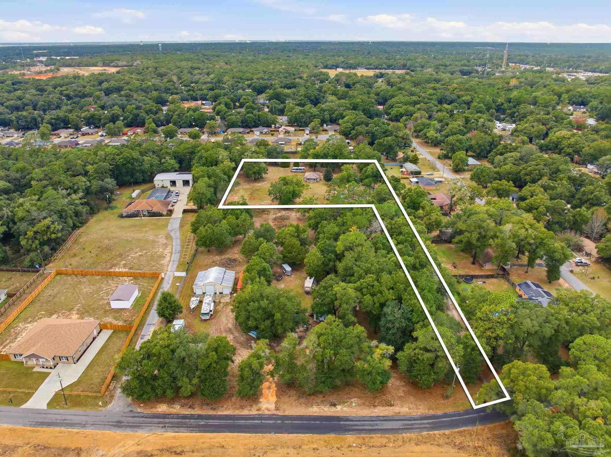 4393 Rice Road Milton, FL 32583 - Photo 44 of 52 an aerial view of house with a swimming pool