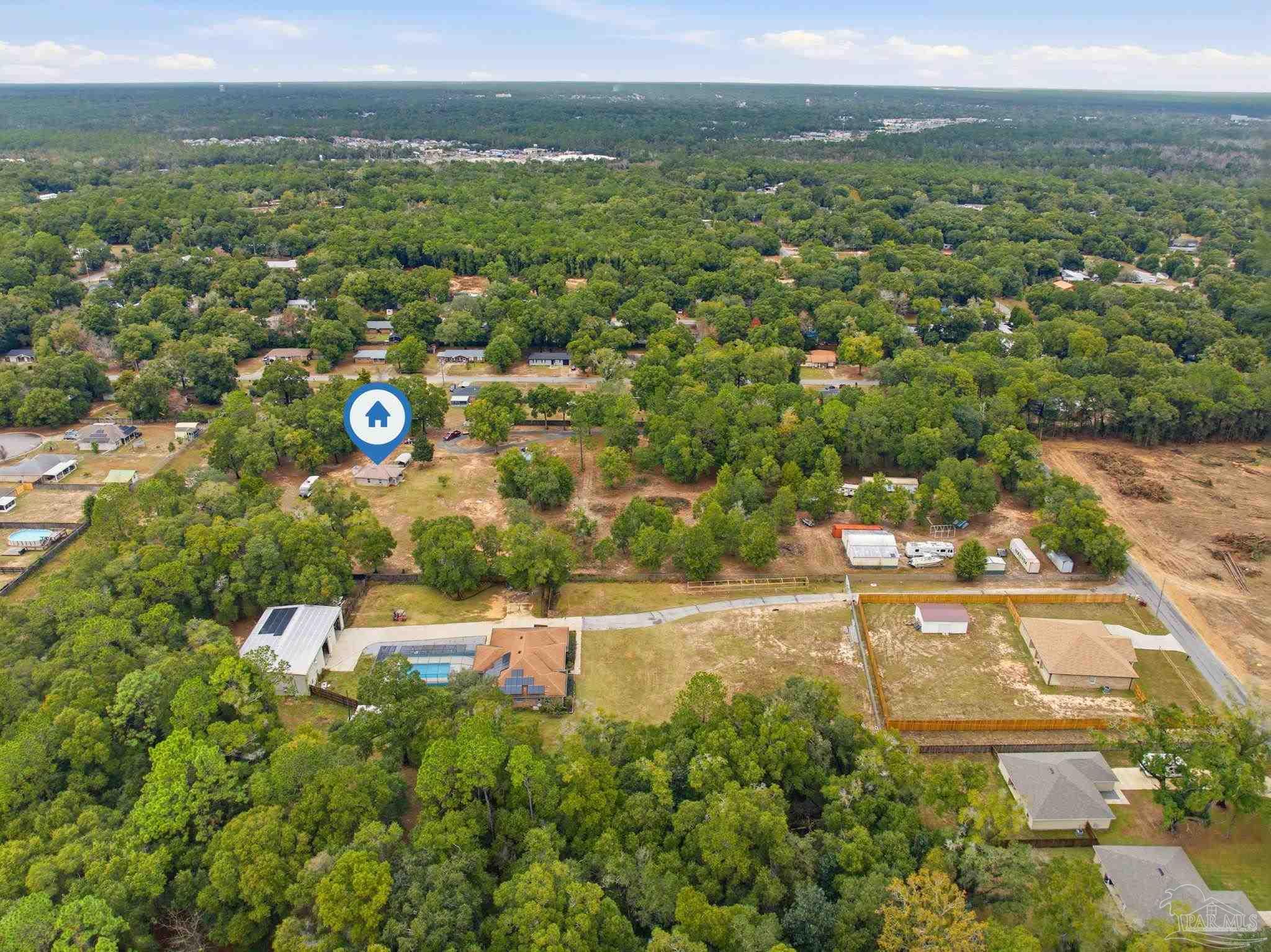 4393 Rice Road Milton, FL 32583 - Photo 47 of 52 an aerial view of residential houses with outdoor space and trees