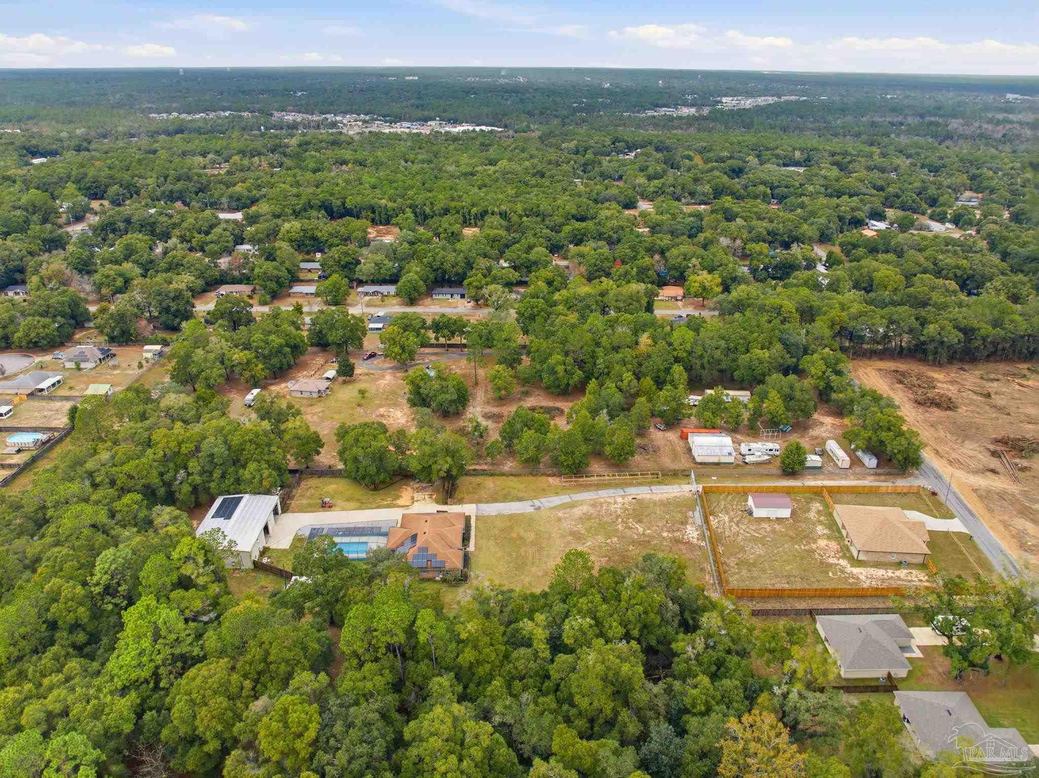 4393 Rice Road Milton, FL 32583 - Photo 48 of 52 an aerial view of residential houses with outdoor space and trees