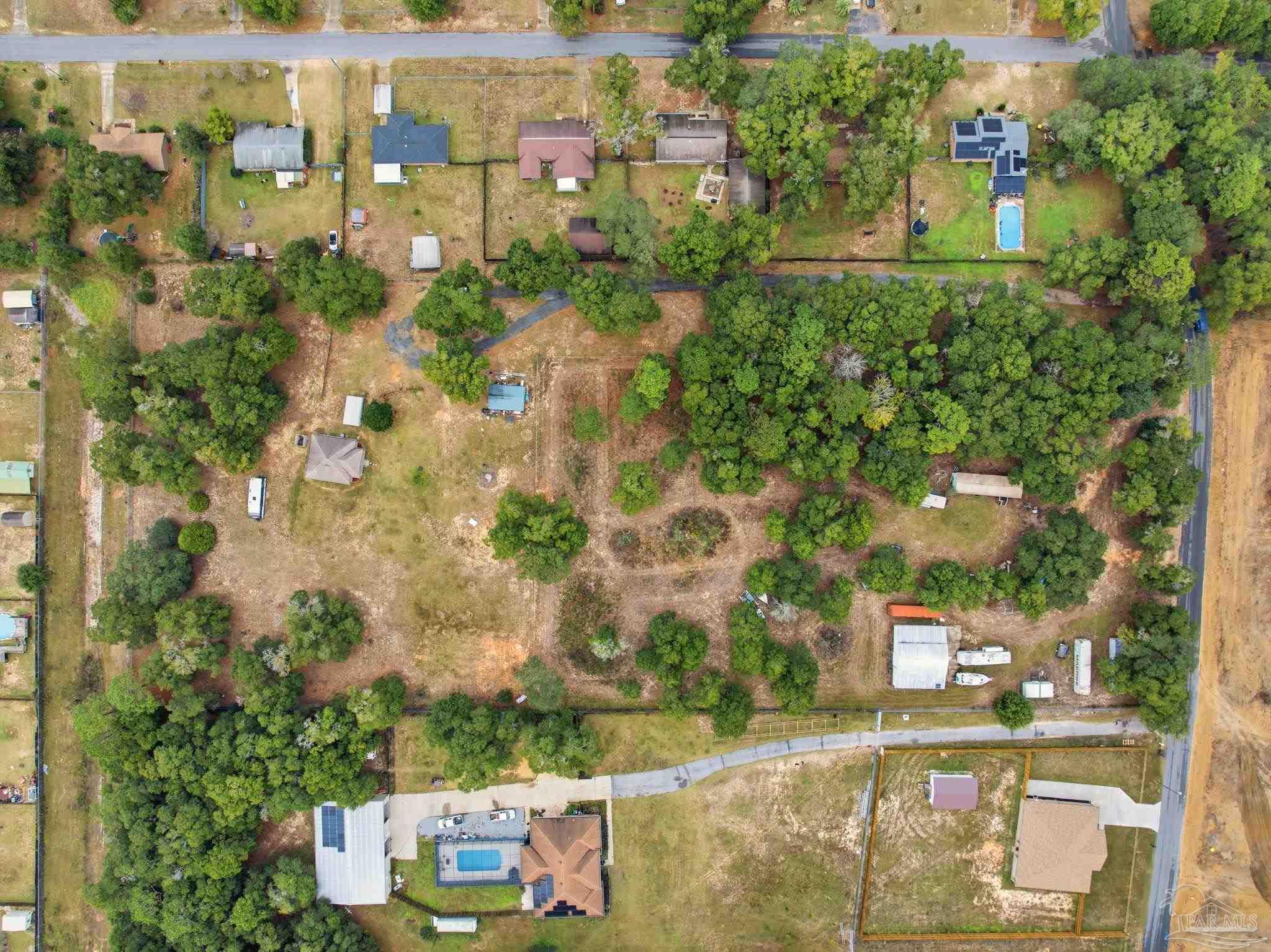 4393 Rice Road Milton, FL 32583 - Photo 49 of 52 an aerial view of residential houses with outdoor space and street view