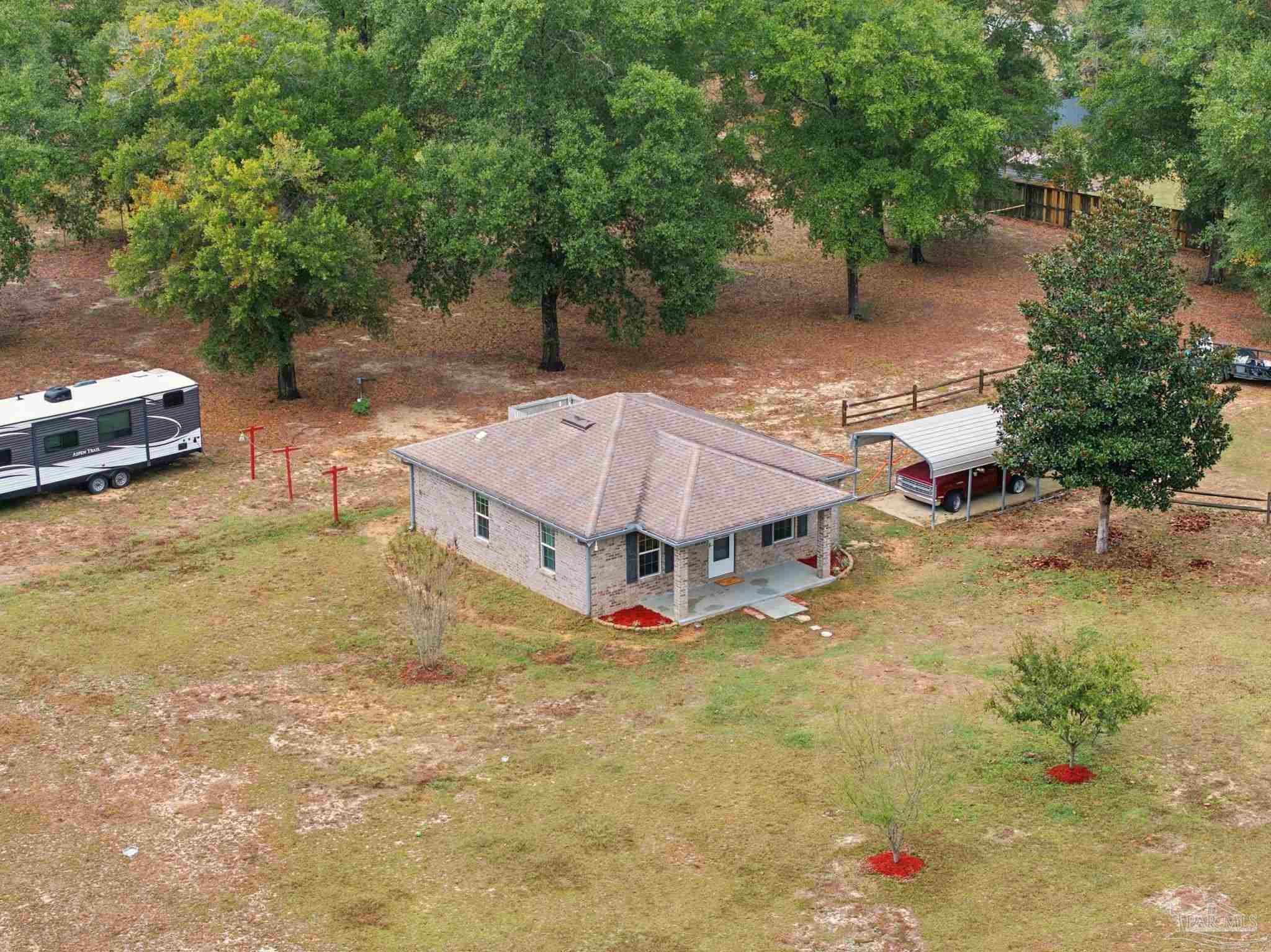 4393 Rice Road Milton, FL 32583 - Photo 50 of 52 a view of a house with swimming pool