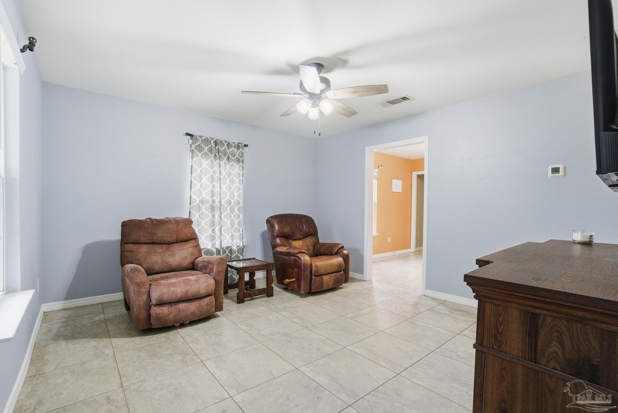 4393 Rice Road Milton, FL 32583 - Photo 7 of 52 a living room with furniture