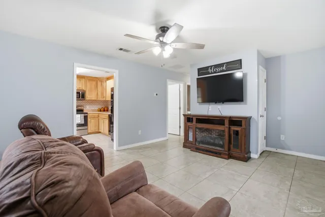 a living room with furniture and a flat screen tv