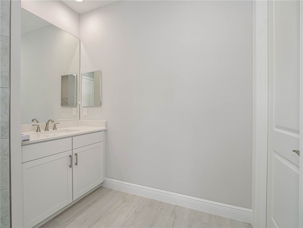 6422 High Pointe W Way Vero Beach, FL 32967 - Photo 16 of 33 a bathroom with a sink and mirror