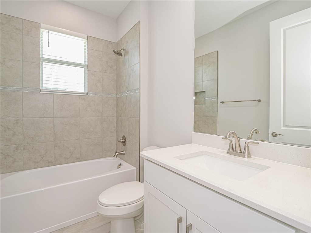 6422 High Pointe W Way Vero Beach, FL 32967 - Photo 22 of 33 a bathroom with a sink toilet and shower