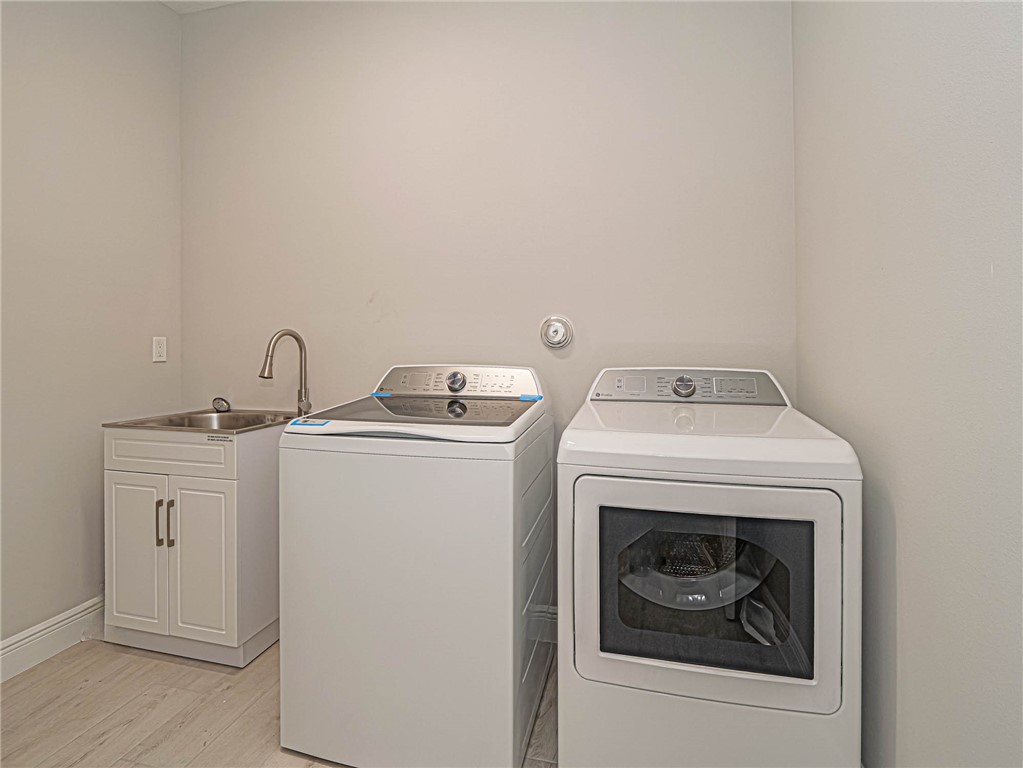 6422 High Pointe W Way Vero Beach, FL 32967 - Photo 26 of 33 a utility room with dryer and washer