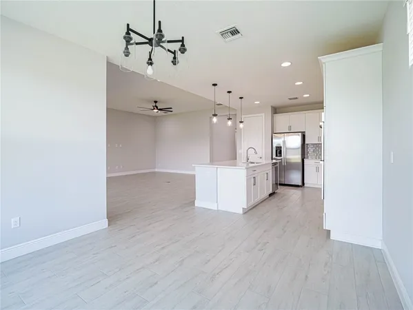 a view of a kitchen with wooden floor