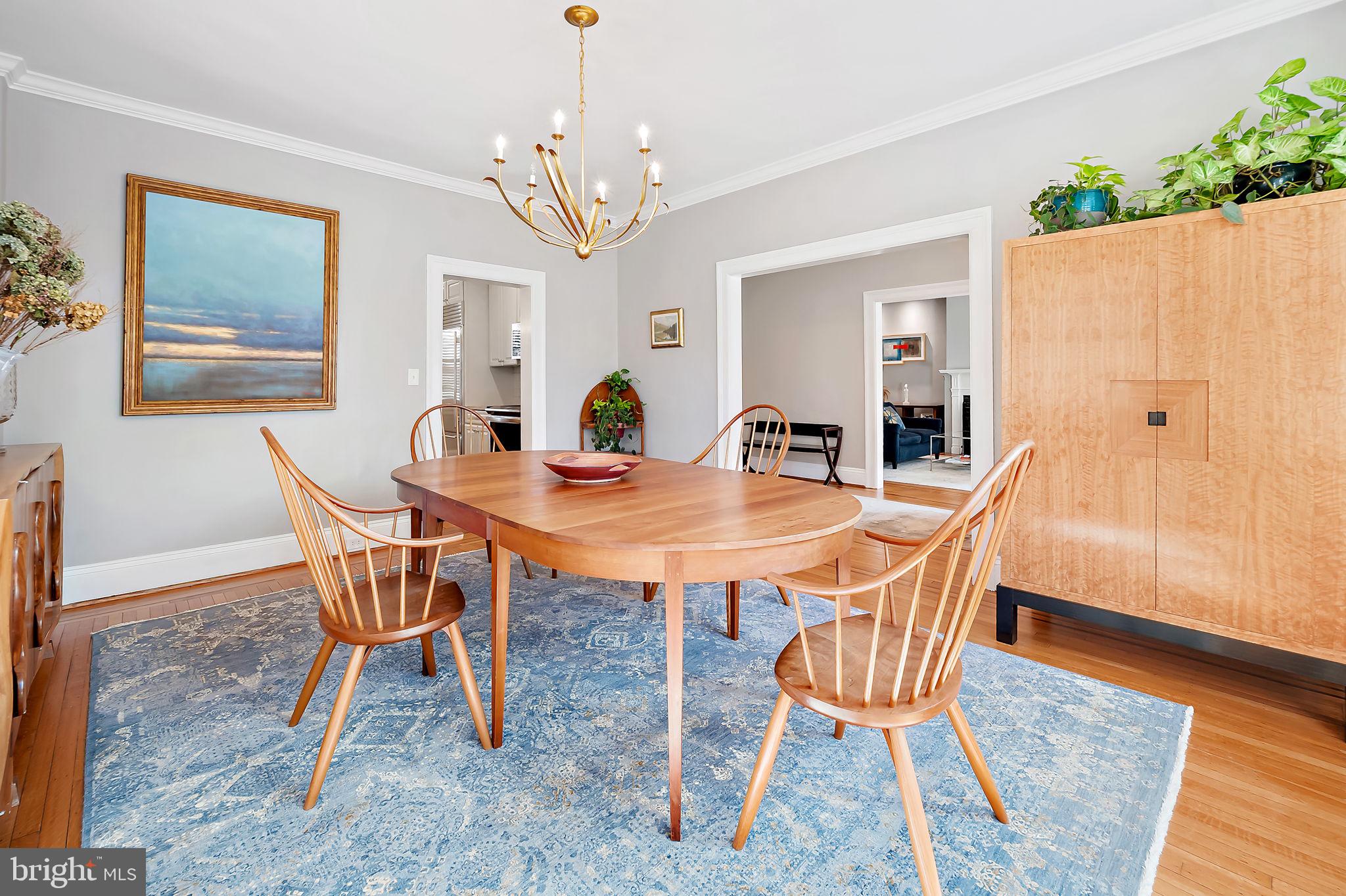 3923 Canterbury Road Baltimore, MD 21218 - Photo 11 of 42 a view of a dining room with furniture and wooden floor