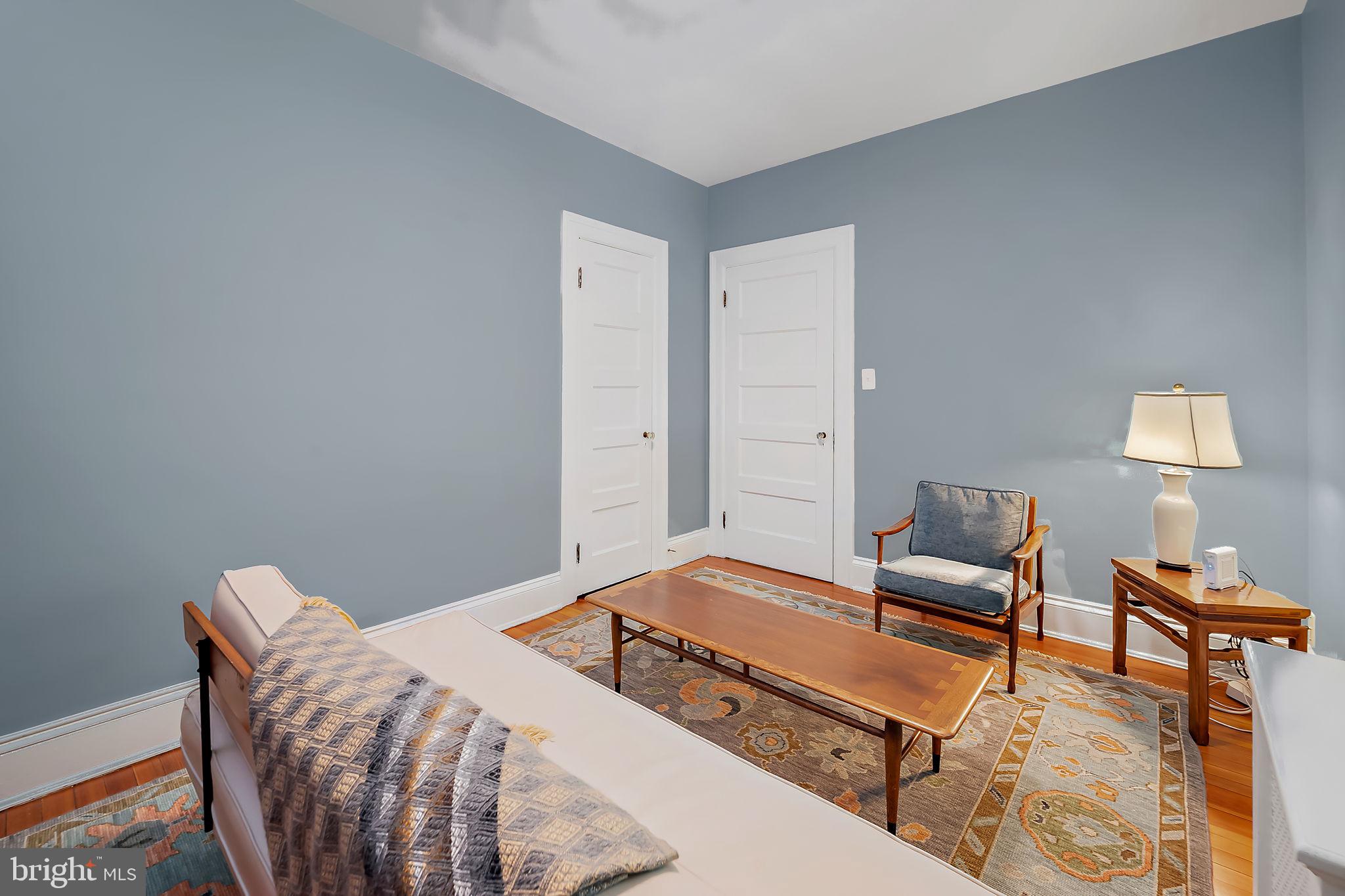 3923 Canterbury Road Baltimore, MD 21218 - Photo 25 of 42 a bedroom with furniture and a lamp