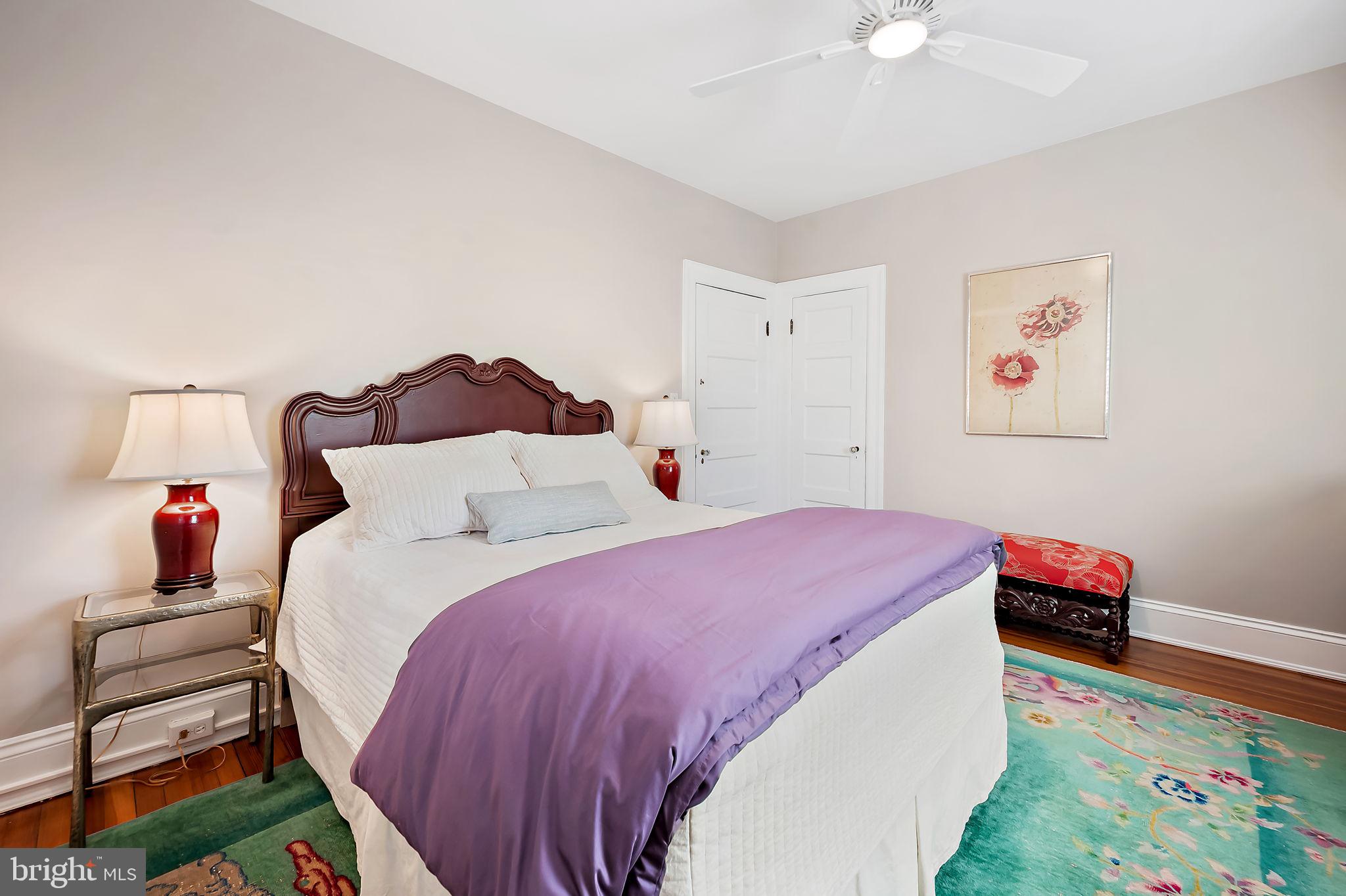 3923 Canterbury Road Baltimore, MD 21218 - Photo 30 of 42 a bedroom with a bed and a chandelier