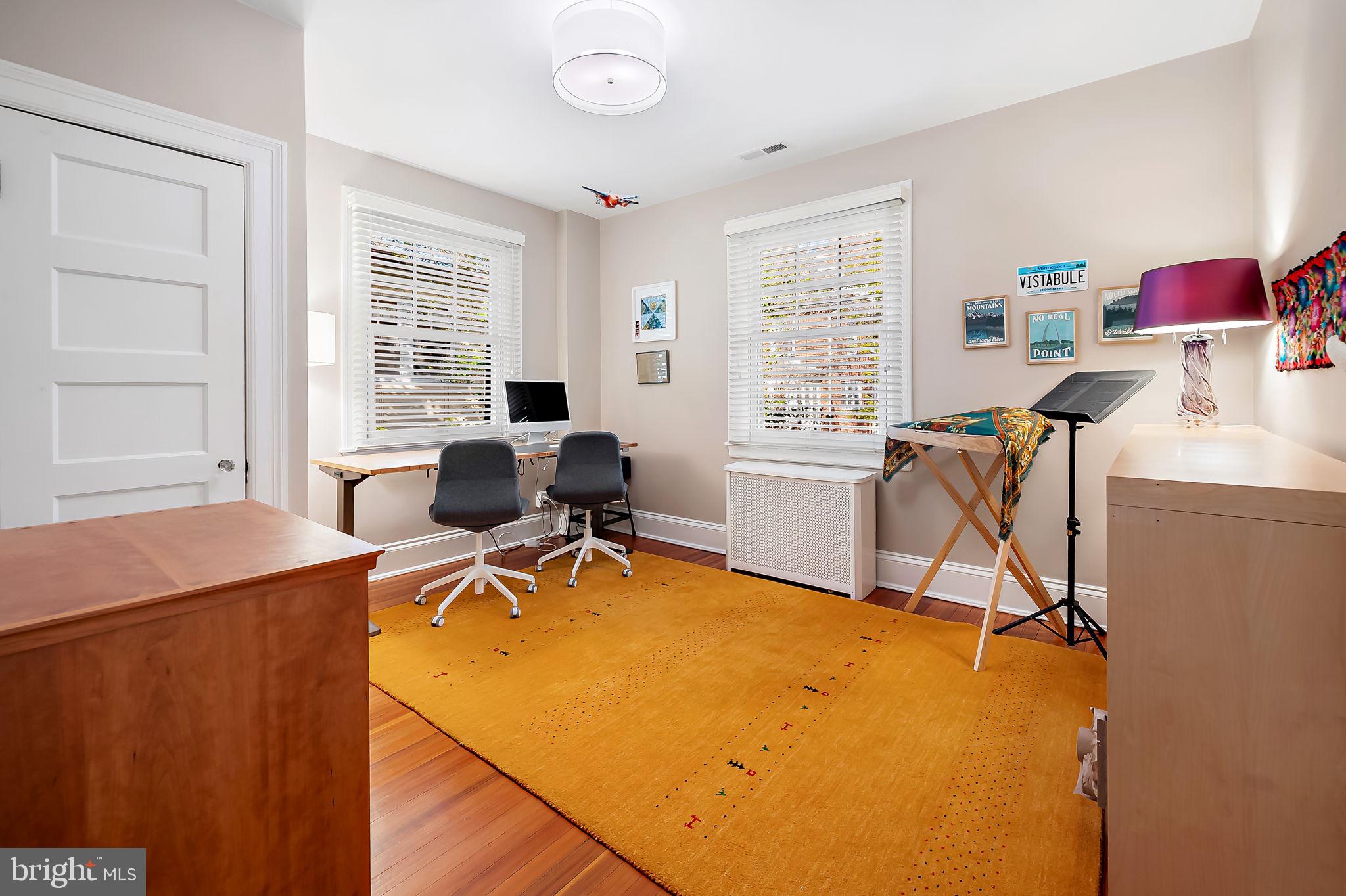 3923 Canterbury Road Baltimore, MD 21218 - Photo 31 of 42 a view of a workspace with furniture and a window